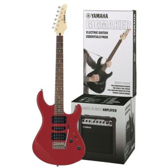 Verdadera guitarra eléctrica roja con amplificador de guitarra