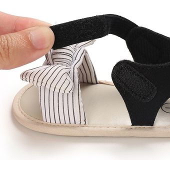 Zapatos de lazo bonito para bebé Sandalias de tela de algodón para niño pequeño zapatos planos antideslizantes nuevo estilo 