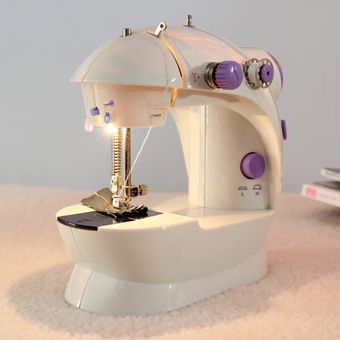 Mini máquina de coser eléctrica portátil trabajo hecho a man 